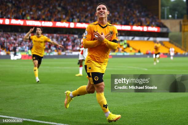 Daniel Podence of Wolverhampton Wanderers celebrates after scoring their team's first goal during the Premier League match between Wolverhampton...