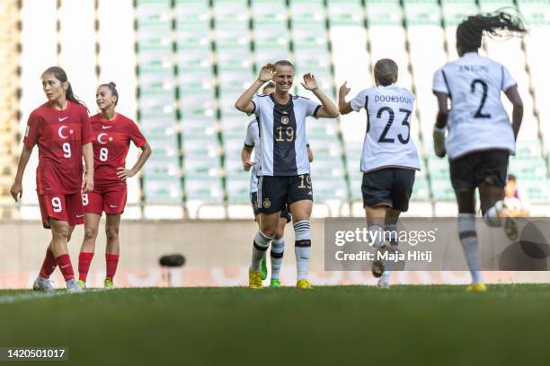 Klara Buehl of Germany celebrates with her team mates after scoring her team second goal during the 2023 FIFA Women's World Cup qualification match...