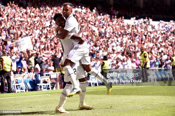 Vinicius Junior of Real Madrid celebrates with teammate Rodrygo after scoring their team's first goal during the LaLiga Santander match between Real...