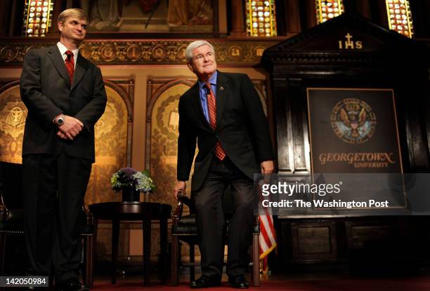 Republican Candidate for President former Speaker Newt Gingrich, joined on stage by Professor George Shambaugh, before speaking to a packed Healy...