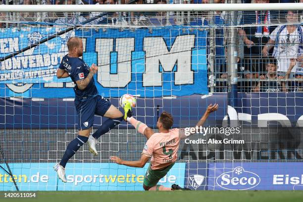 Philipp Hofmann of VfL Bochum scores a goal which is later disallowed whilst under pressure from Niklas Stark of SV Werder Bremen during the...