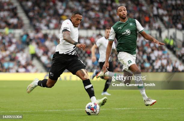 Nathaniel Mendez-Laing of Derby County is challenged by Brendan Galloway of Plymouth Argyle during the Sky Bet League One between Derby County and...