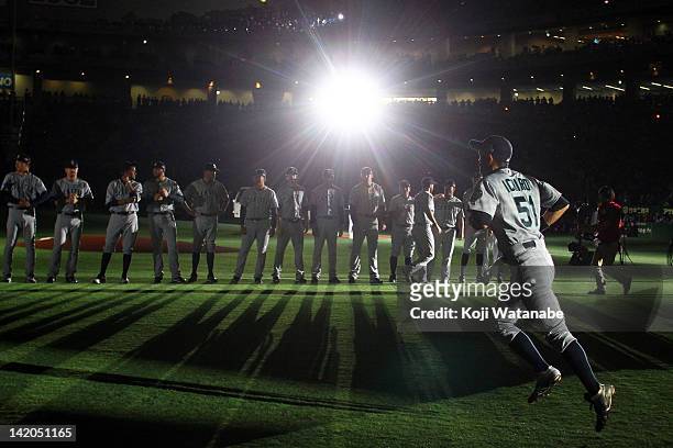 Outfielder Ichiro Suzuki of Seattle Mariners runs to line up for national anthem during MLB match between Seattle Mariners and Oakland Athletics at...