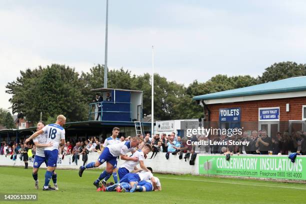Connor Comber of Bury AFC celebrates with team mates after scoring their side's second goal during the The Emirates FA Cup First Round Qualifying...