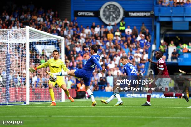 Ben Chilwell of Chelsea scores their team's first goal past Lukasz Fabianski of West Ham United during the Premier League match between Chelsea FC...