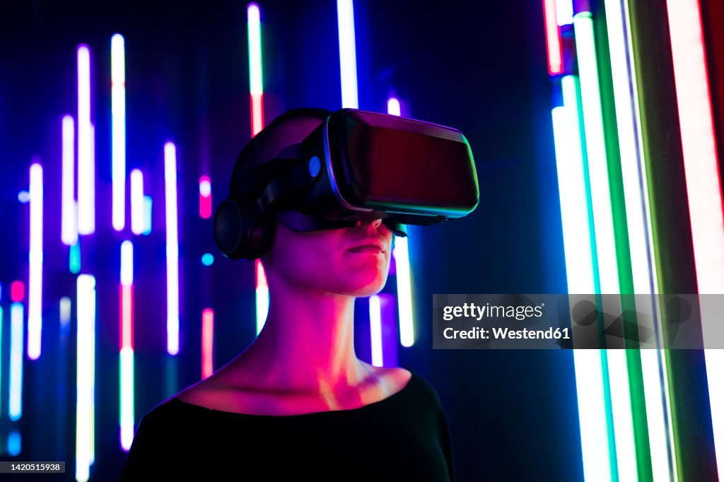 Colorful Video Simulation Woman Wearing Virtual Reality Simulator Near Colorful Illuminated ...