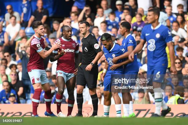 Michail Antonio of West Ham United clashes with Reece James of Chelsea during the Premier League match between Chelsea FC and West Ham United at...