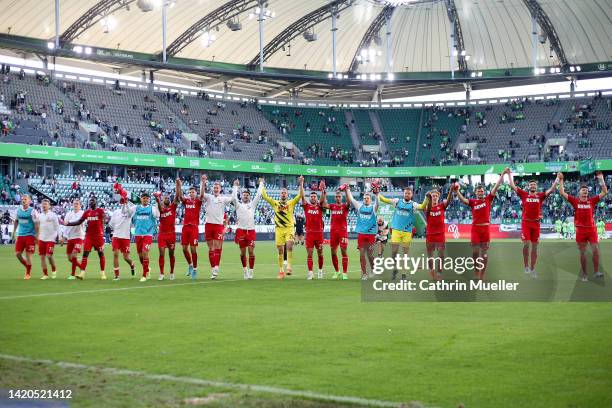 Players of 1.FC Köln celebrates after the final whistle of the Bundesliga match between VfL Wolfsburg and 1. FC Köln at Volkswagen Arena on September...