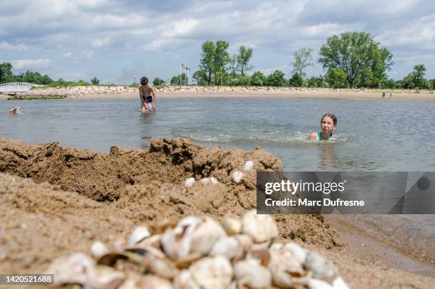 two teenagers playing at the beach - connecticut people stock pictures, royalty-free photos & images