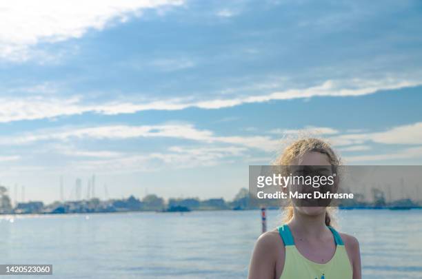 headshot of teenage girl by water - groton stock pictures, royalty-free photos & images