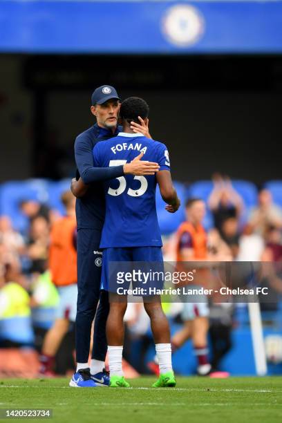 Thomas Tuchel embraces Wesley Fofana of Chelsea after their sides victory during the Premier League match between Chelsea FC and West Ham United at...