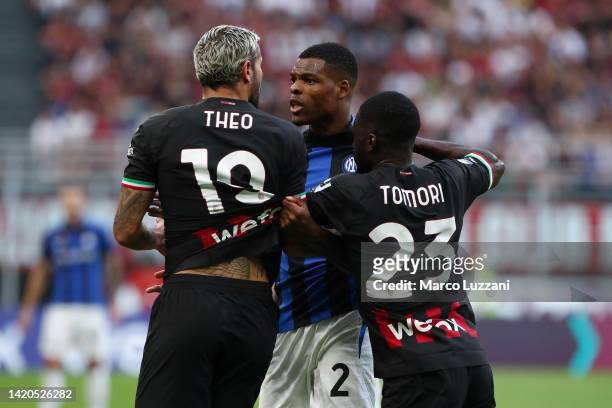 Theo Hernandez of AC Milan confronts Denzel Dumfries of FC Internazionale during the Serie A match between AC Milan and FC Internazionale at Stadio...