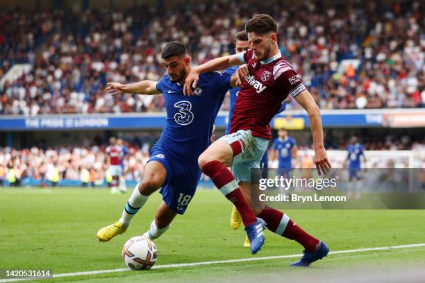 Armando Broja of Chelsea is challenged by Declan Rice of West Ham United during the Premier League match between Chelsea FC and West Ham United at...