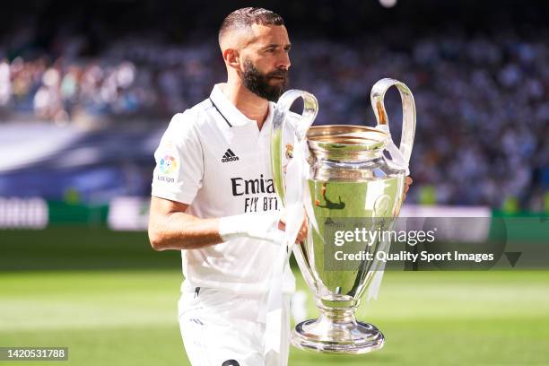 Karim Benzema of Real Madrid holds the UEFA Champions League trophy, awarded for winning the UEFA Champions League prior to the LaLiga Santander...