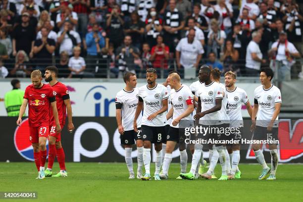 Sebastian Rode of Eintracht Frankfurt celebrates with teammates after scoring their team's second goal during the Bundesliga match between Eintracht...