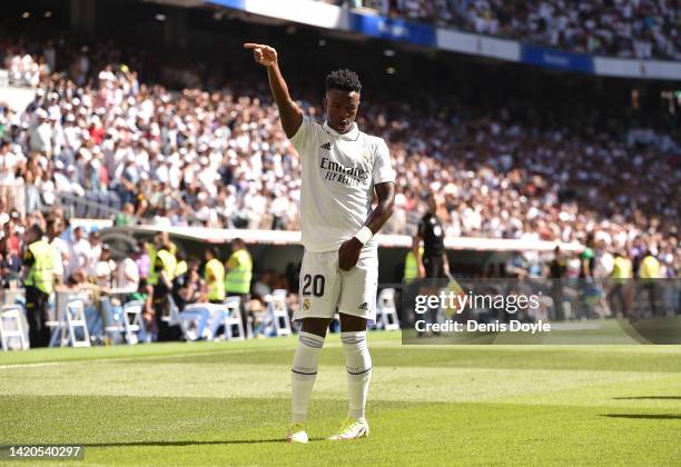 Vinicius Junior of Real Madrid celebrates after scoring their team's opening goal during the LaLiga Santander match between Real Madrid CF and Real...