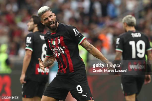 Olivier Giroud of AC Milan celebrates scoring their side's third goal during the Serie A match between AC Milan and FC Internazionale at Stadio...