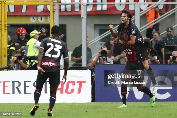 Rafael Leao of AC Milan celebrates scoring their side's first goal with teammate Sandro Tonali during the Serie A match between AC Milan and FC...