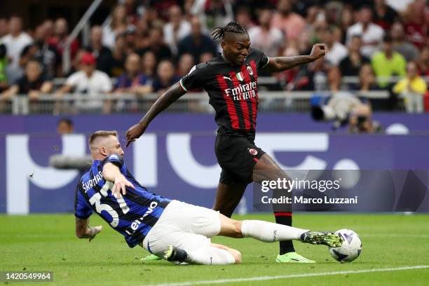 Milan Skriniar of FC Internazionale challenges Rafael Leao of AC Milan during the Serie A match between AC Milan and FC Internazionale at Stadio...