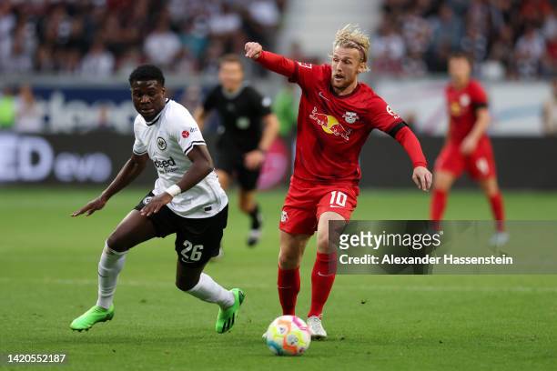 Emil Forsberg of RB Leipzig is put under pressure by Eric Junior Dina Ebimbe of Eintracht Frankfurt during the Bundesliga match between Eintracht...
