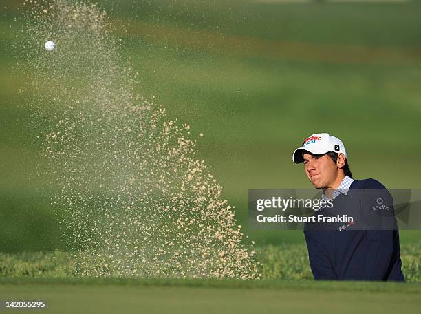 Matteo Manassero of Italy plays a bunker shot during the first round of the Sicilian Open at Verdura Golf and Spa Resort on March 29, 2012 in...