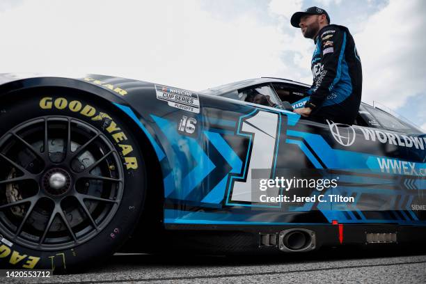 Ross Chastain, driver of the Worldwide Express Chevrolet, enters his car during qualifying for the NASCAR Cup Series Cook Out Southern 500 at...