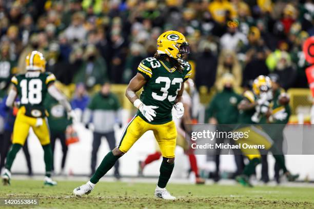 Aaron Jones of the Green Bay Packers lines up during an NFL divisional playoff football game against the San Francisco 49ers at Lambeau Field on...