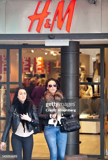 Customer exit an Hennes & Mauritz AB store in Malmo, Sweden, on Thursday, March 29, 2012. Hennes & Mauritz AB, Europe's second-largest clothing...