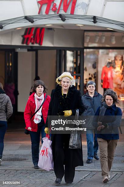 Customers exit an Hennes & Mauritz AB store in Malmo, Sweden, on Thursday, March 29, 2012. Hennes & Mauritz AB, Europe's second-largest clothing...