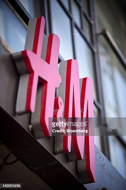 Logo sits outside a Hennes & Mauritz AB store in Malmo, Sweden, on Thursday, March 29, 2012. Hennes & Mauritz AB, Europe's second-largest clothing...