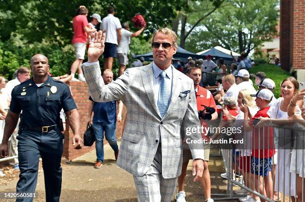 Head coach Lane Kiffin of the Mississippi Rebels waves at fans prior to the game against the Troy Trojans at Vaught-Hemingway Stadium on September...