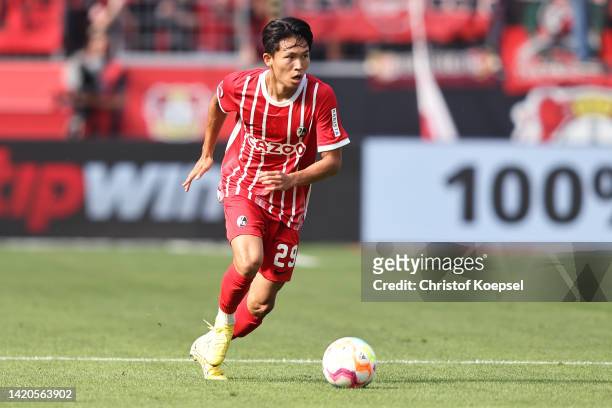 Woo-yeong Jeong of Freiburg runs with the ball during the Bundesliga match between Bayer 04 Leverkusen and Sport-Club Freiburg at BayArena on...