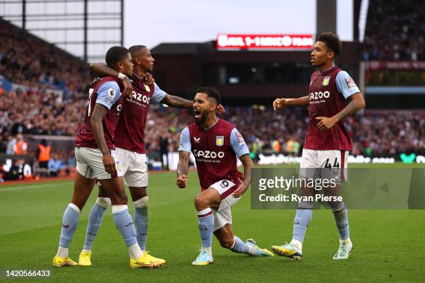 Leon Bailey of Aston Villa celebrates with teammates after scoring their team's first goal during the Premier League match between Aston Villa and...