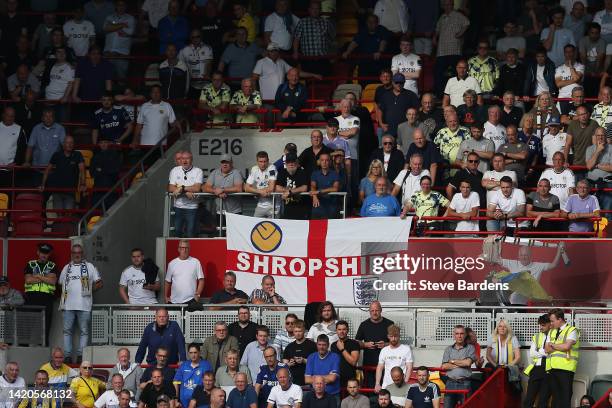 Leeds United supporters watch the action during the Premier League match between Brentford FC and Leeds United at Brentford Community Stadium on...