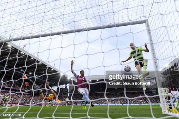 Erling Haaland of Manchester City scores their team's first goal during the Premier League match between Aston Villa and Manchester City at Villa...