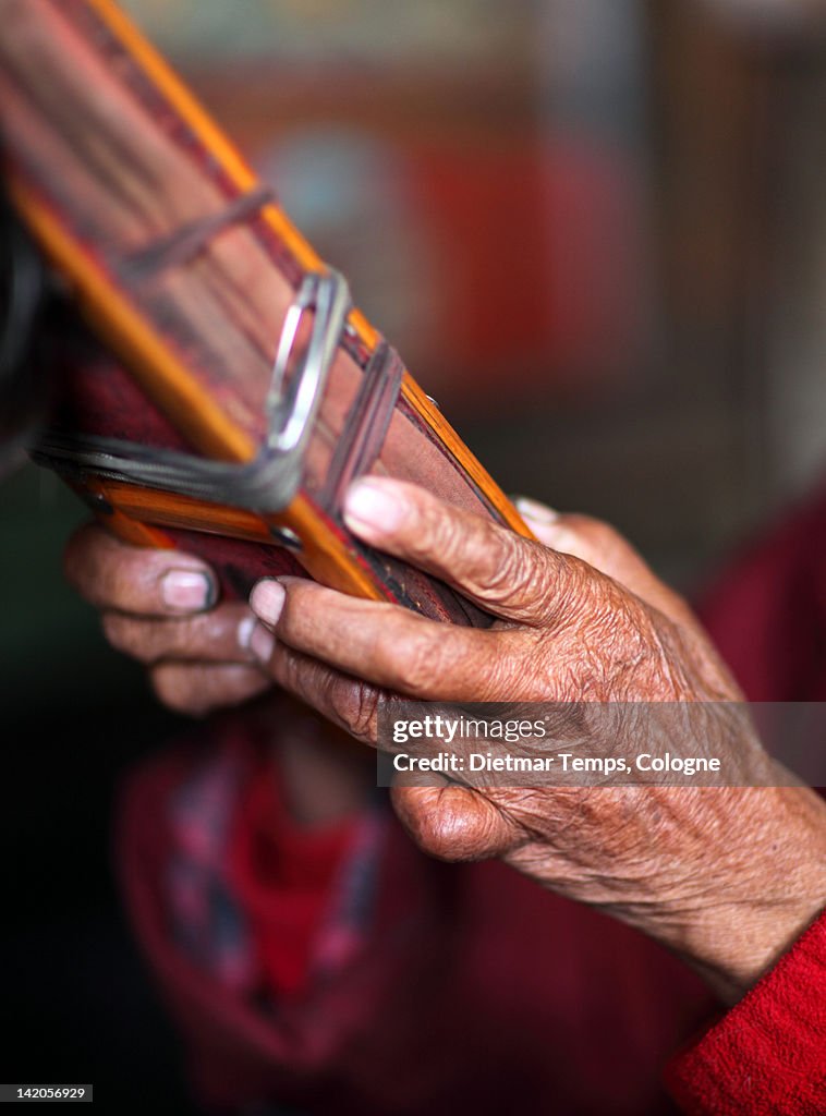 Hands of old holy man