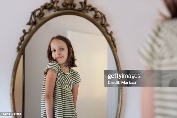 girl standing in front of mirror at home - croatia girls stock pictures, royalty-free photos & images