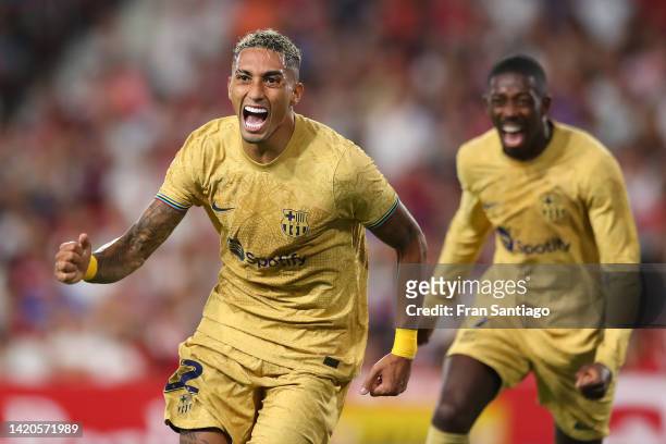 Raphinha of FC Barcelona celebrates scoring their side's first goal during the LaLiga Santander match between Sevilla FC and FC Barcelona at Estadio...