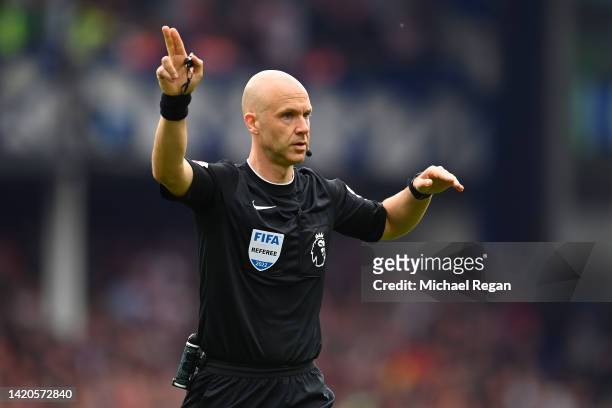 Referee Anthony Taylor gestures during the Premier League match between Everton FC and Liverpool FC at Goodison Park on September 03, 2022 in...