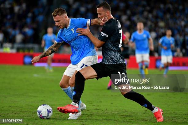 Ciro Immobile of SS Lazio compete for the ball with Amir Kadri Rrahman of SSC Napoli during the Serie A match between SS Lazio and SSC Napoli at...