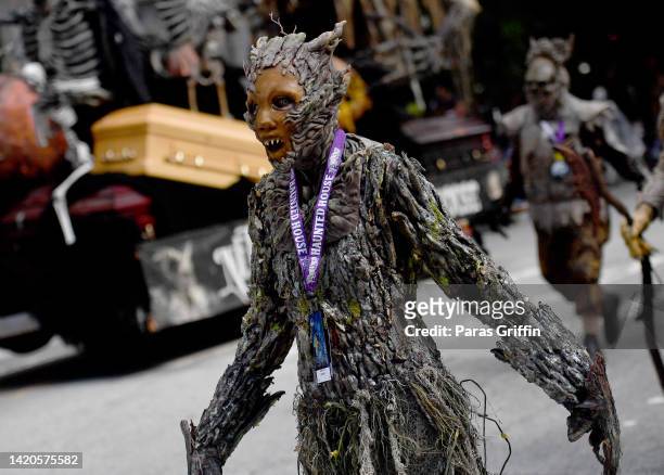 Cosplayer dressed as a zombie walk in the 2022 Dragon Con Parade on September 03, 2022 in Atlanta, Georgia.