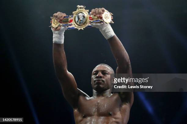 Dan Azeez celebrates their victory with their match belt after defeating Shaken Pitters during the 12x3 British Light-Heavyweight Title fight between...