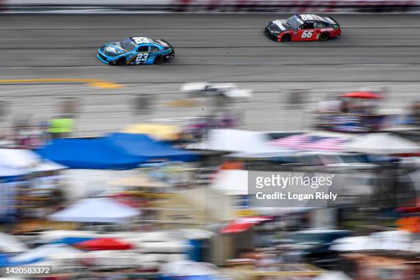 Anthony Alfredo, driver of the Carolina Cowboys Chevrolet, and JJ Yeley, driver of the Wild Willies Toyota, race during the NASCAR Xfinity Series...
