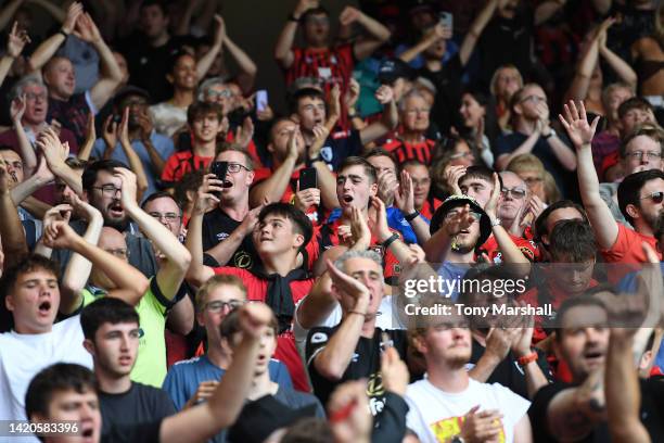 Fans of AFC Bournemouth celebrates their teams win after the final whistle during the Premier League match between Nottingham Forest and AFC...