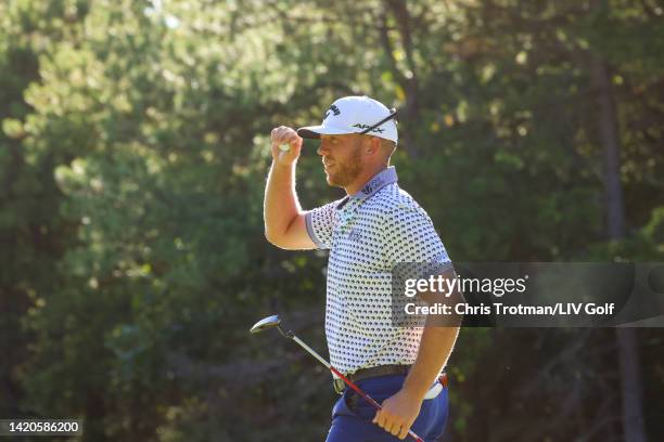 Talor Gooch of 4 Aces GC reacts after a birdie putt on the 15th green during Day Two of the LIV Golf Invitational - Boston at The Oaks golf course at...