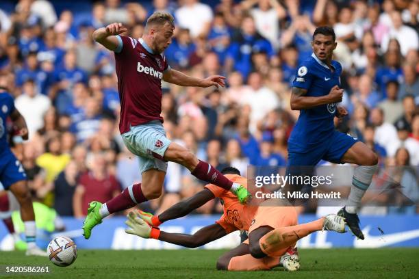 Jarrod Bowen of West Ham United fouls Edouard Mendy of Chelsea leading to a VAR decision to disallow West Ham's 2nd goal during the Premier League...