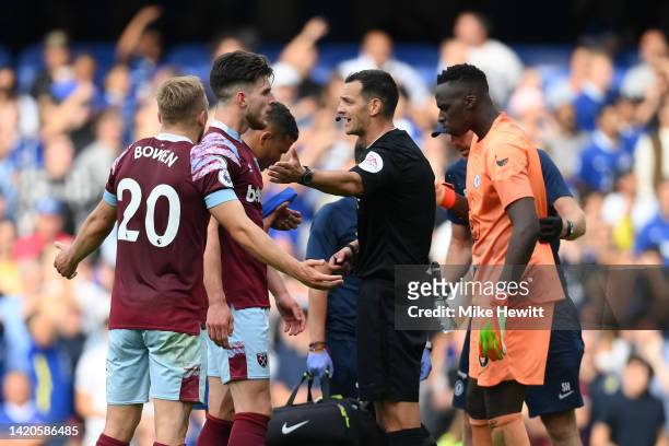 Jarrod Bowen and Declan Rice of West Ham United remonstrate with Referee Andy Madley after a VAR decision ruled out a West Ham United goal by Maxwel...
