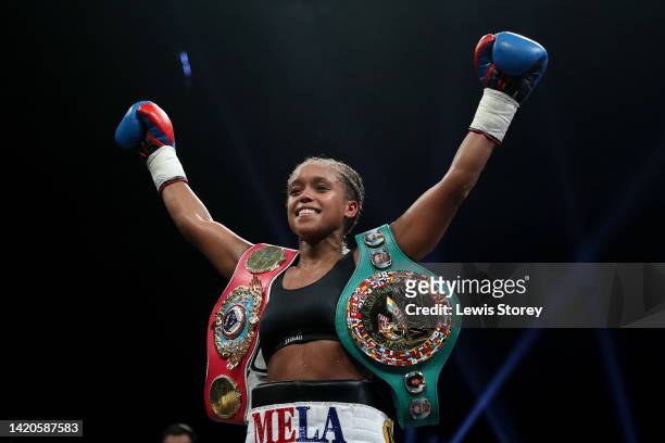 Natasha Jonas celebrates with their title belts after their victory after defeating Patricia Berghult during the 10x2 WBO / WBC Super-Welterweight...