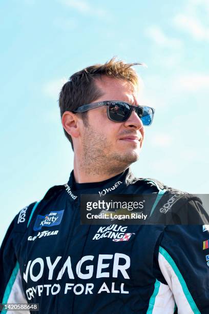 Landon Cassill, driver of the Voyager: Crypto for All Chevrolet, looks on during practice for the NASCAR Xfinity Series Sport Clips Haircuts VFW Help...