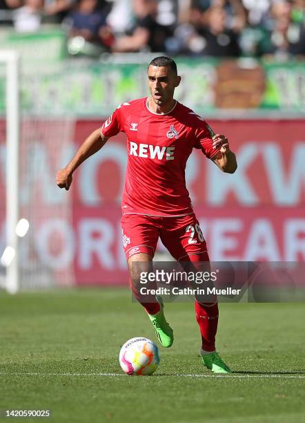 Ellyes Skhiri of 1. FC Koeln runs with the ball during the Bundesliga match between VfL Wolfsburg and 1. FC Köln at Volkswagen Arena on September 03,...